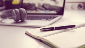 Notepad pen headset PPT background picture