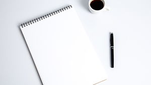 Immagine del fondo della tazza PPT della tazza di caffè della penna del blocco note