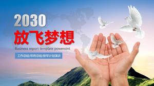 手里拿着白鸽子的新年工作计划的PPT模板